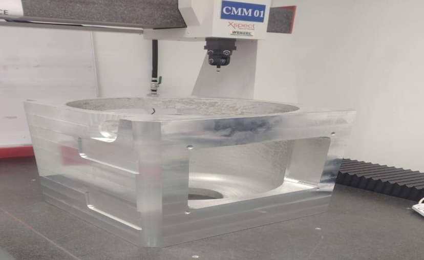 Machined component under CMM inspection